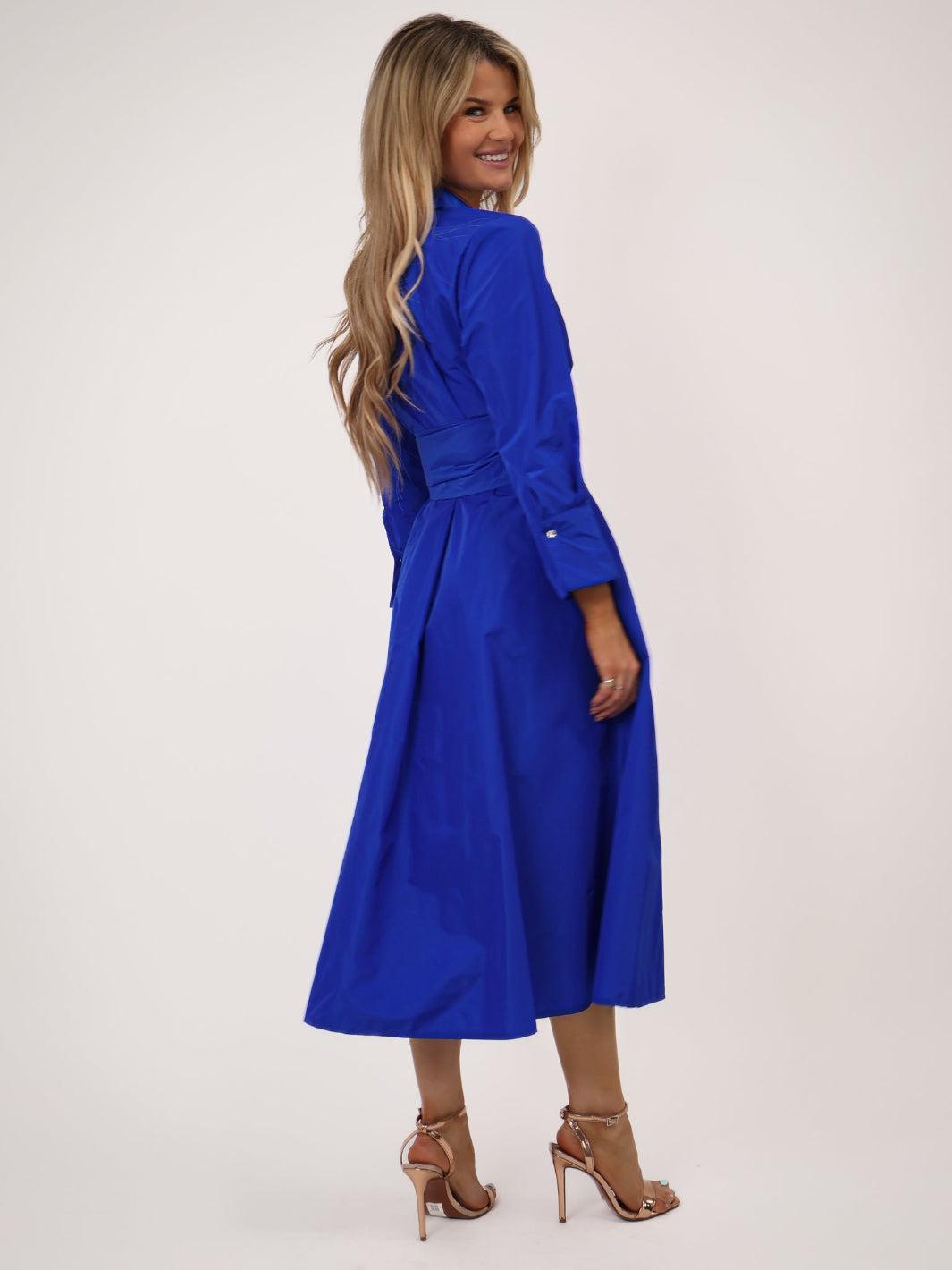 Woman wearing a blue dress on a white background