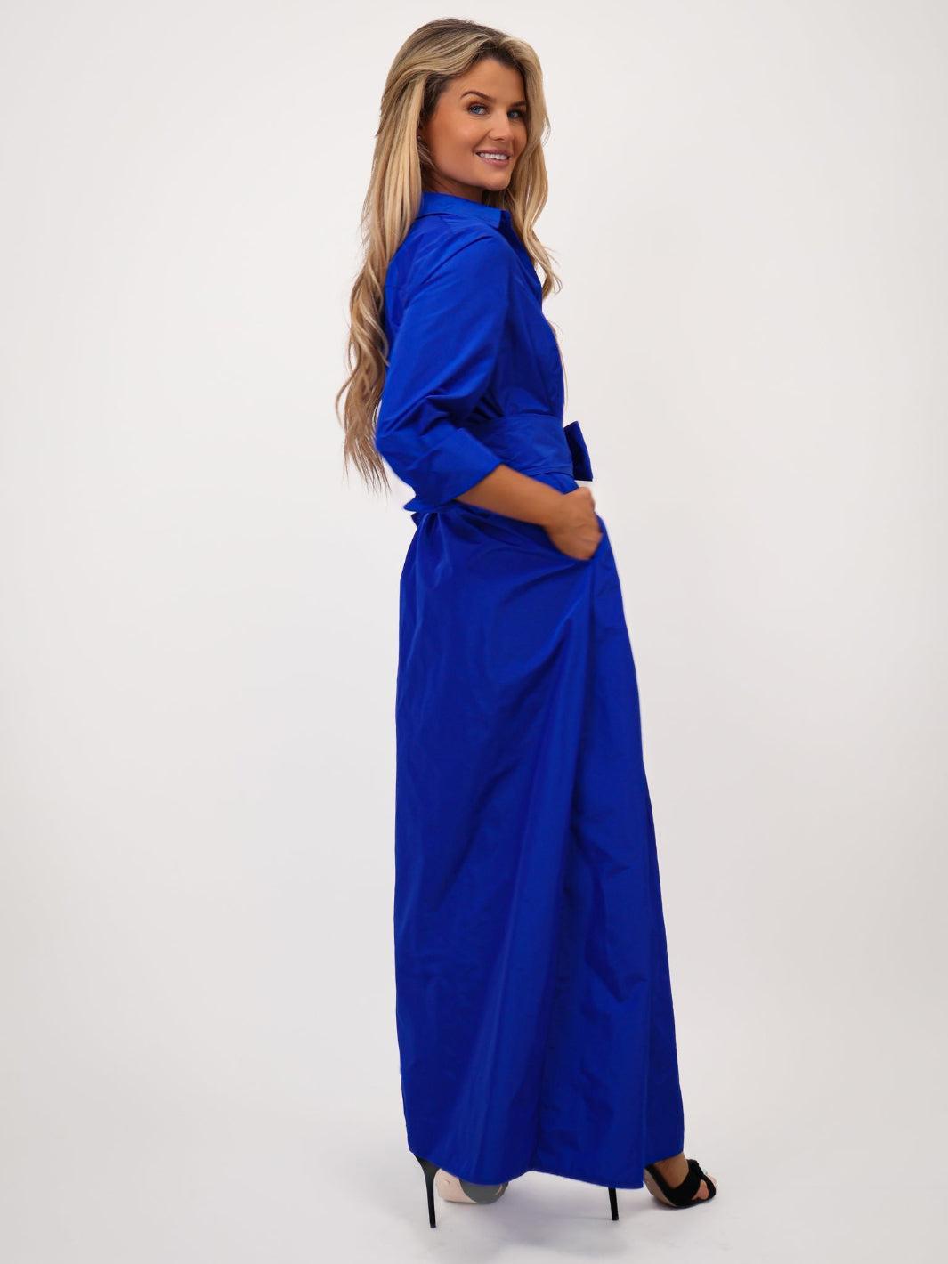 Woman wearing a blue dress on a white background