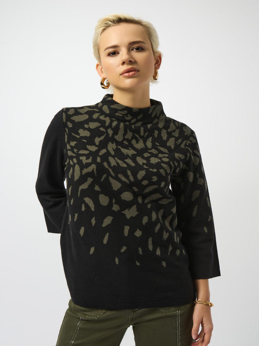 Woman wearing a black turtleneck with a patterned overlay on a white background
