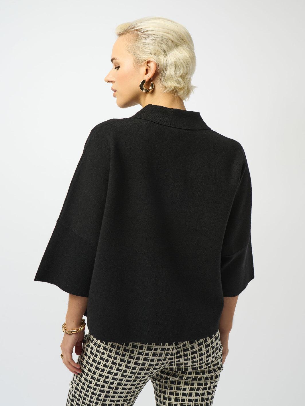 Person wearing a black jacket and checkered pants on a white background