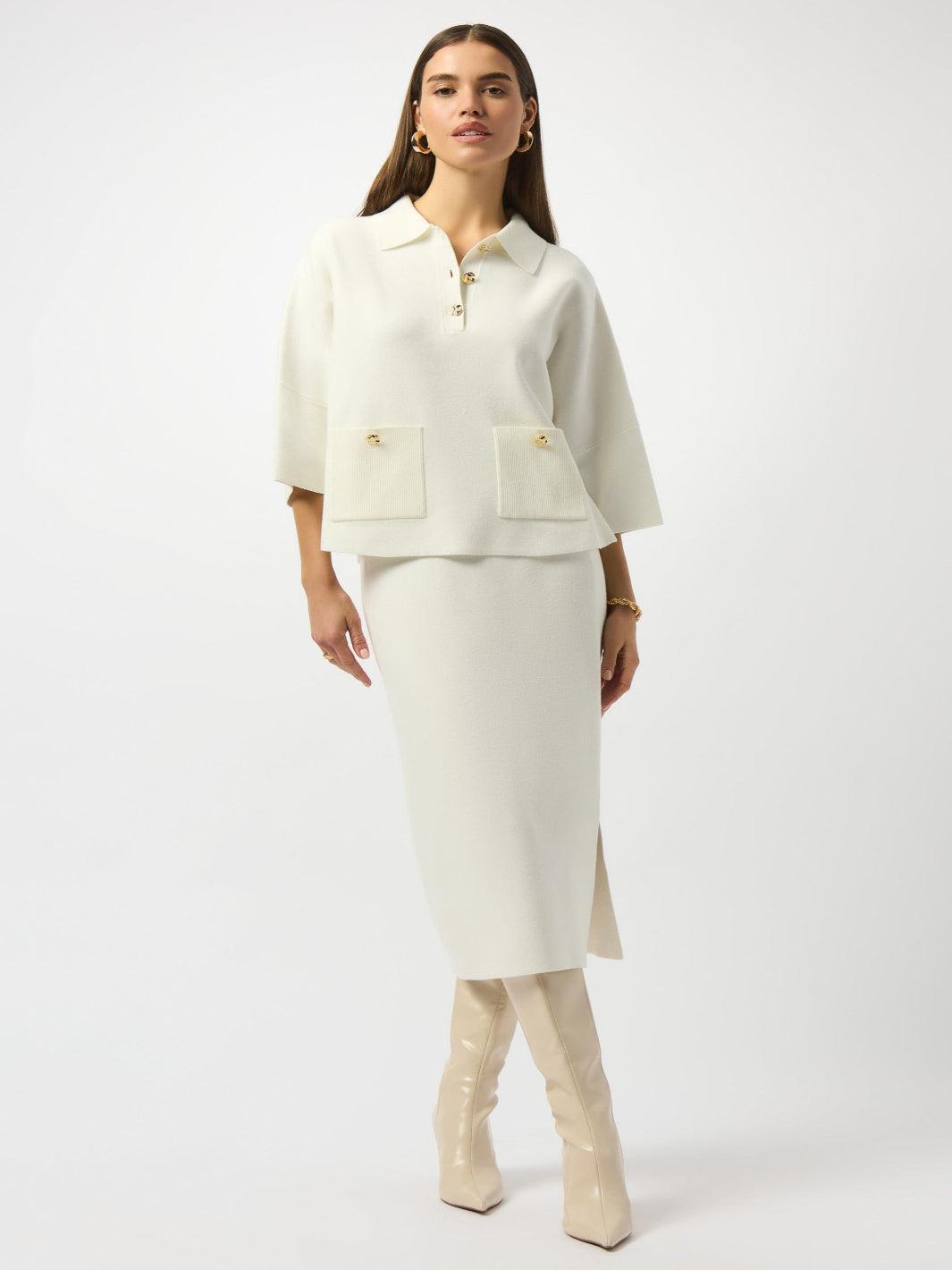 Woman wearing a cream-colored suit with a white background