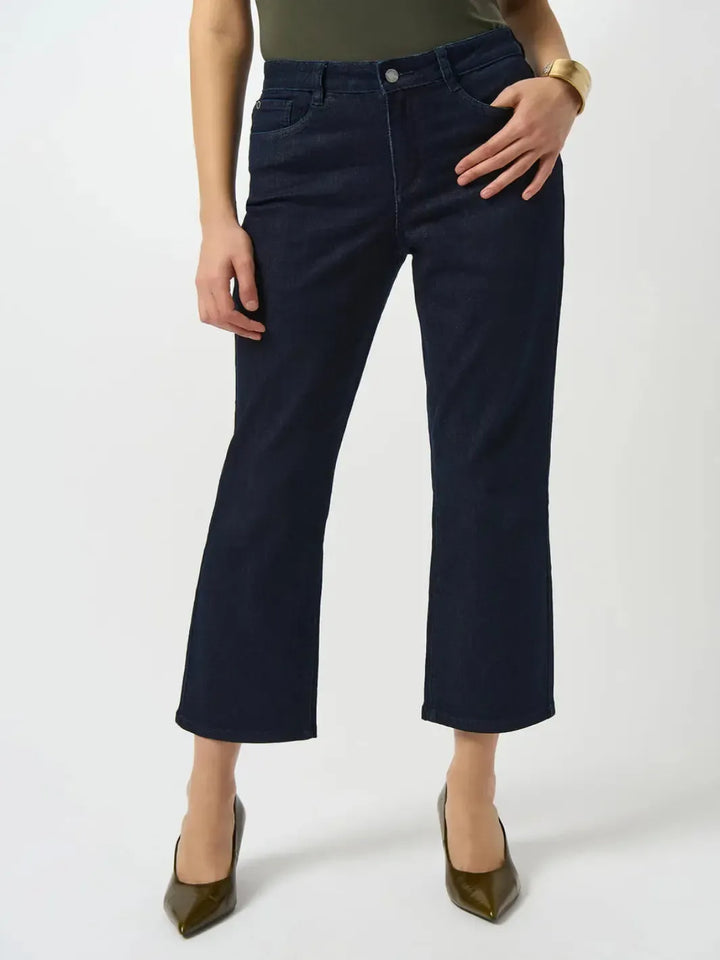 Person wearing navy blue pants on a white background