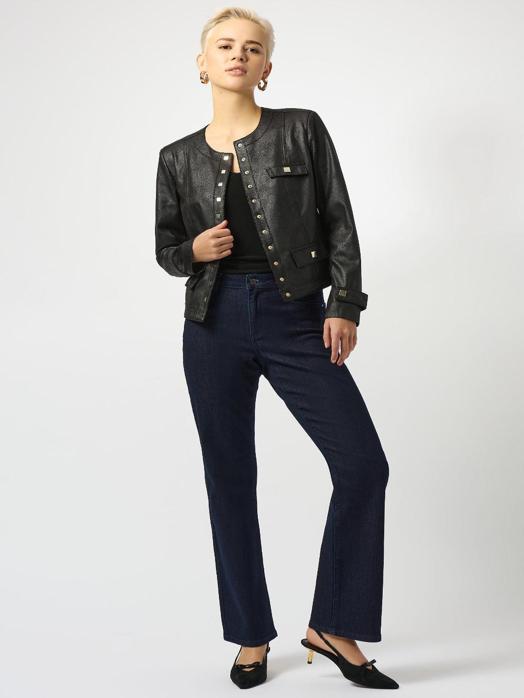 Person wearing a black leather jacket with studded details on a white background