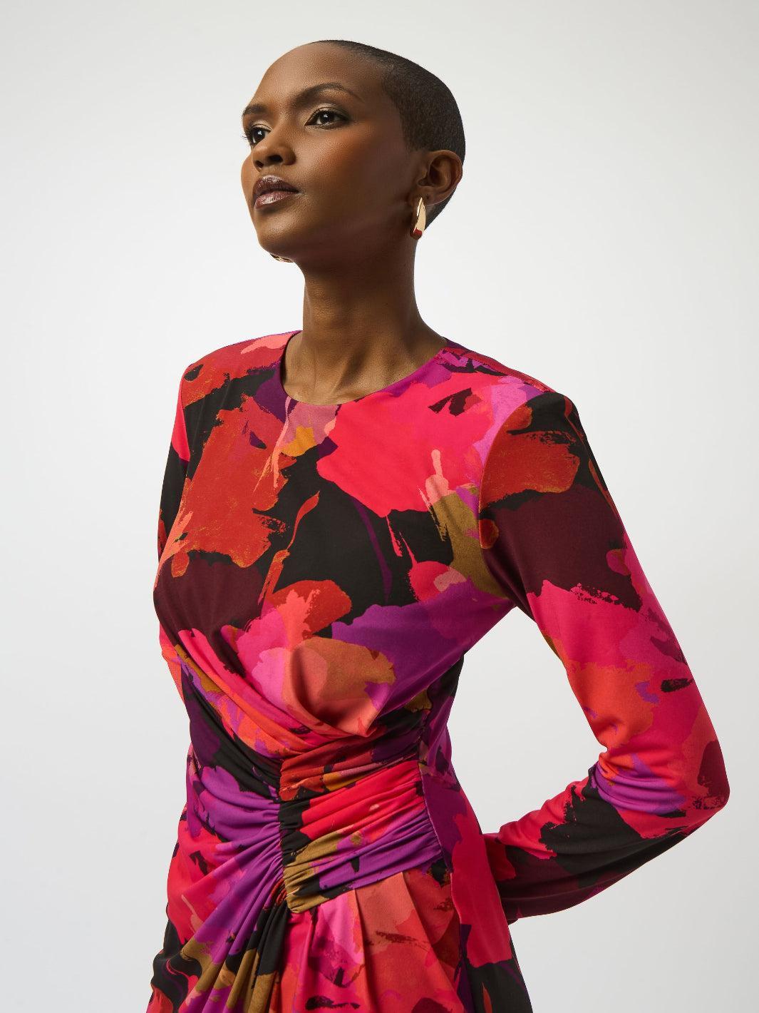 Woman wearing a colorful dress with a white background