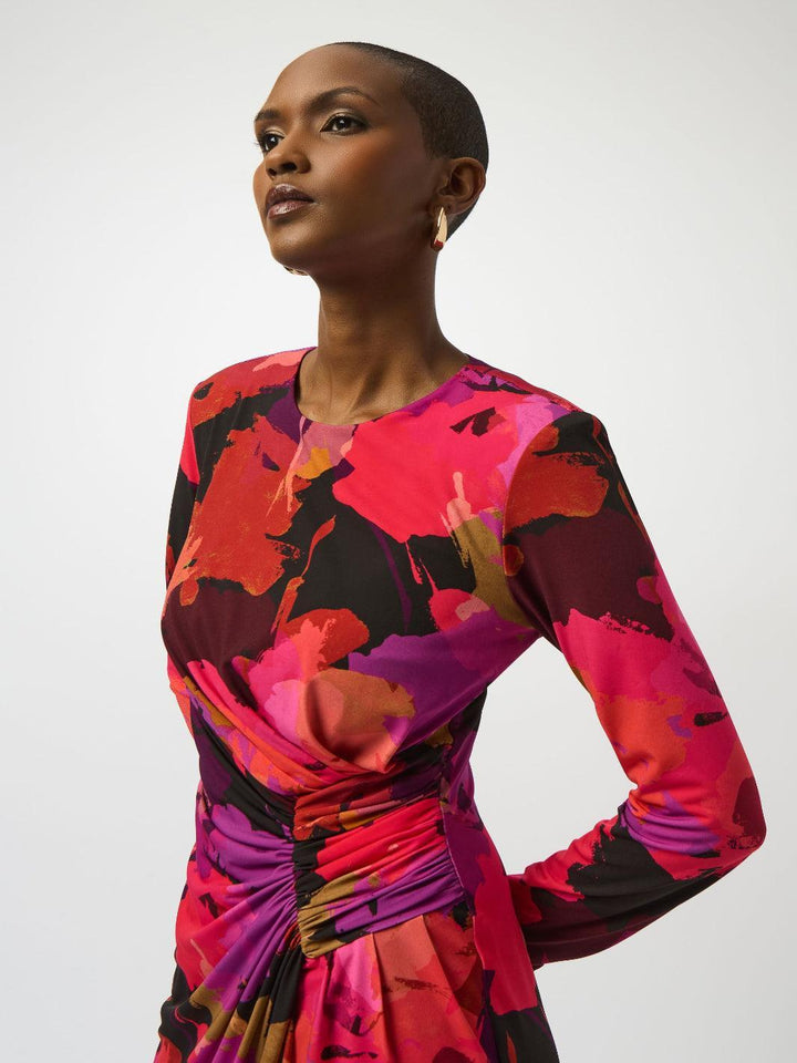 Woman wearing a colorful dress with a white background