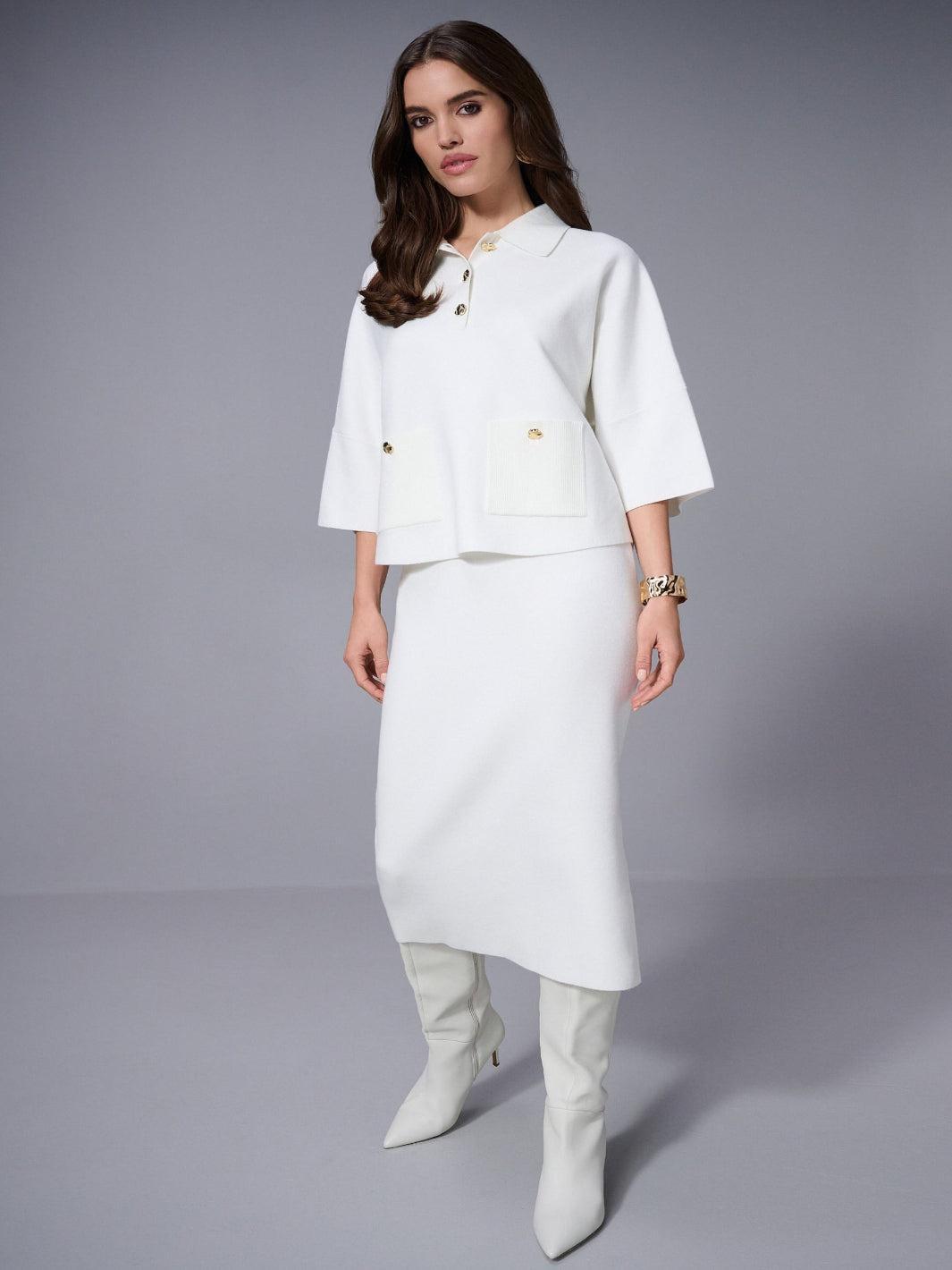 Woman wearing a white outfit with a jacket and skirt on a gray background