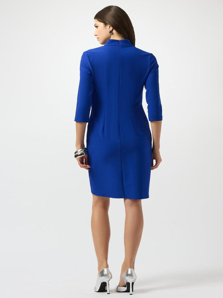 Woman wearing a blue dress on a white background