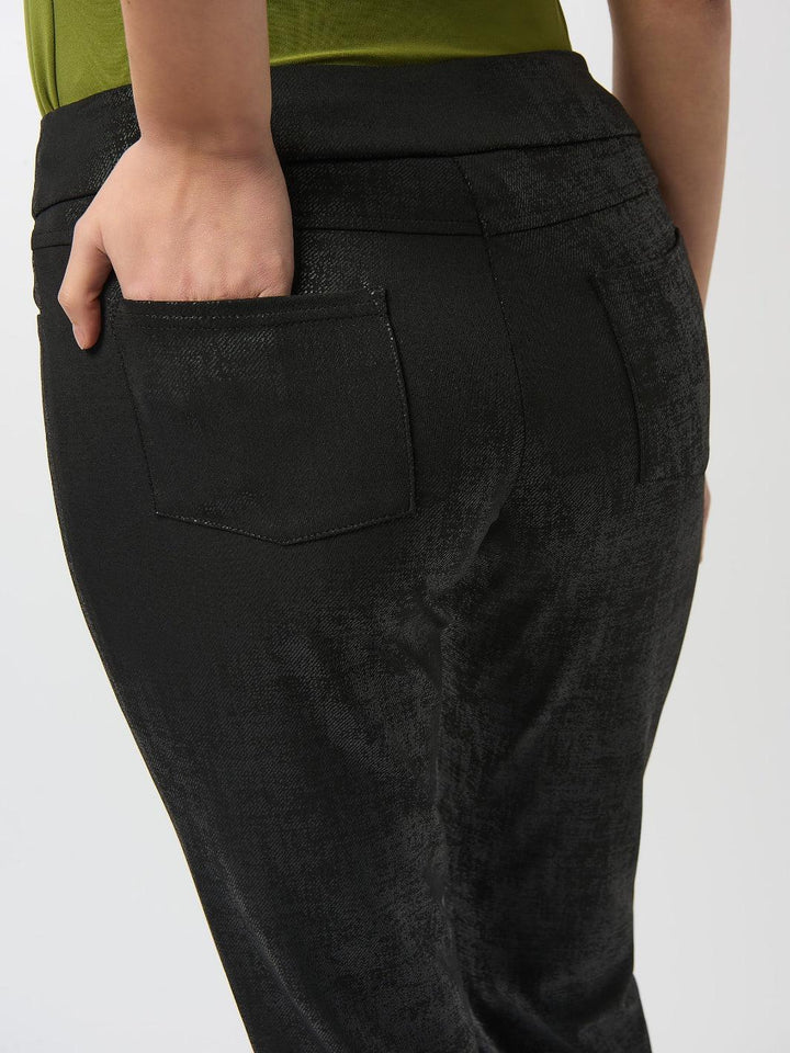 Black pants with a pocket detail on a white background