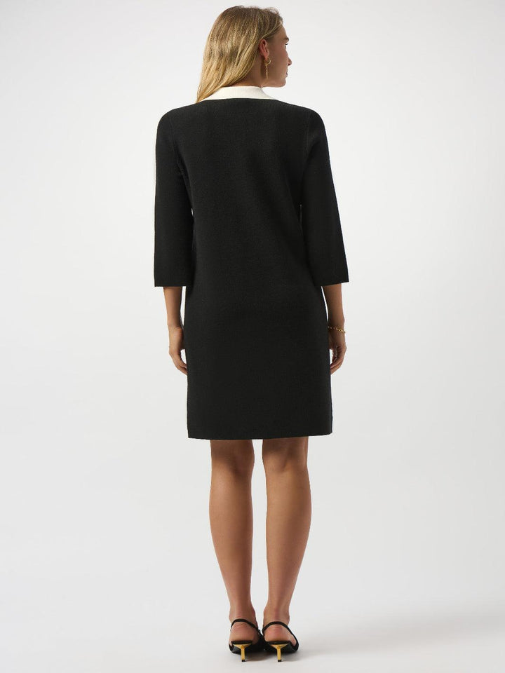 Woman wearing a black dress on a white background
