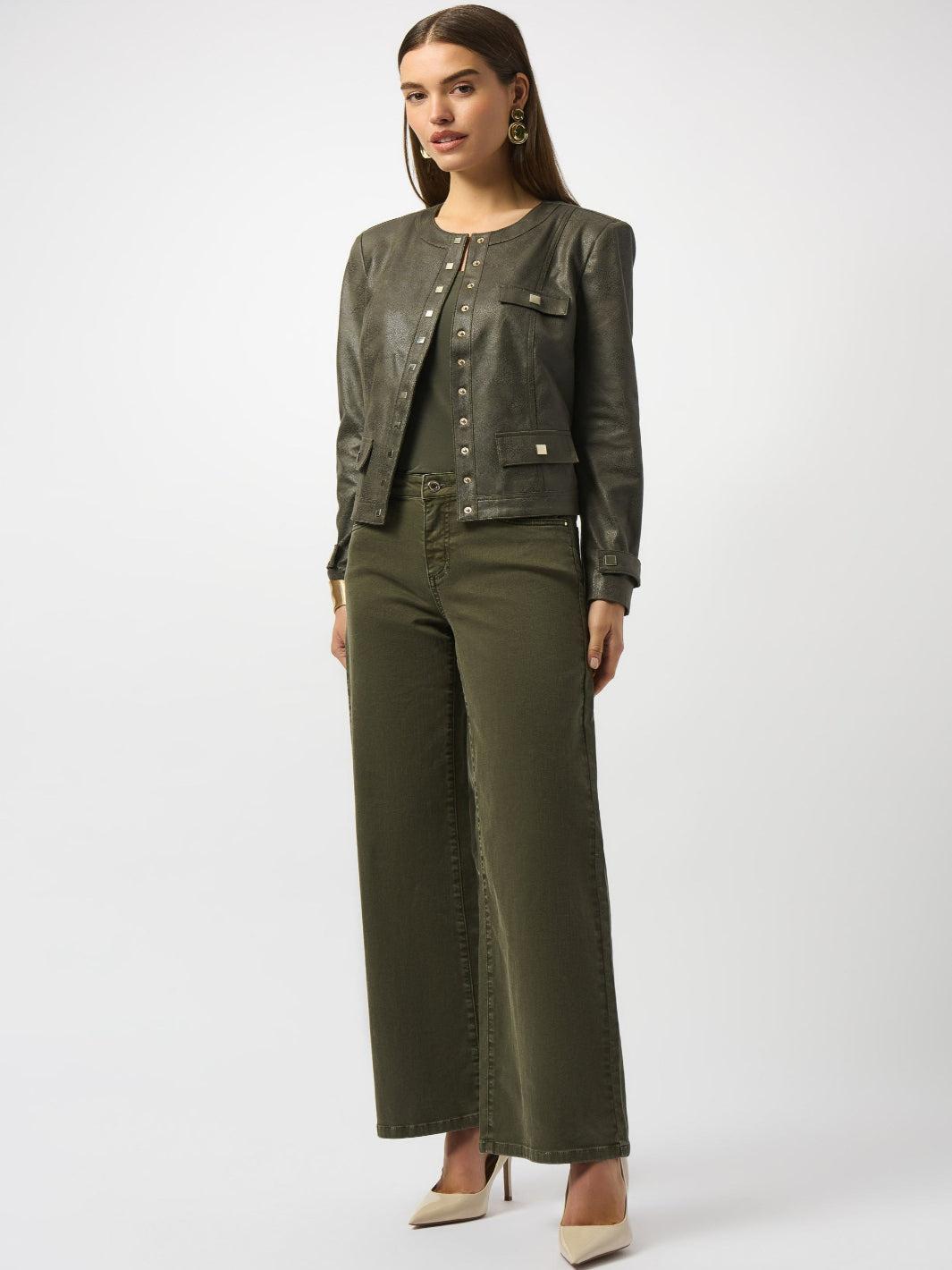 Woman wearing a green jacket and wide-leg pants on a white background