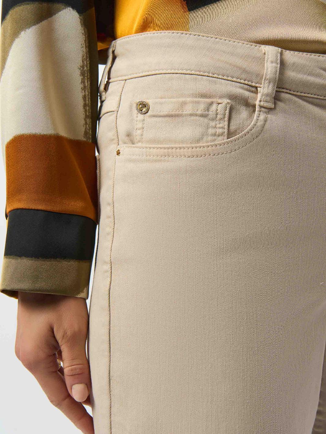Close-up of beige pants with a blurred background