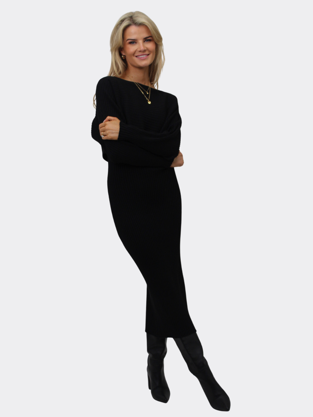 Woman wearing a black outfit on a white background