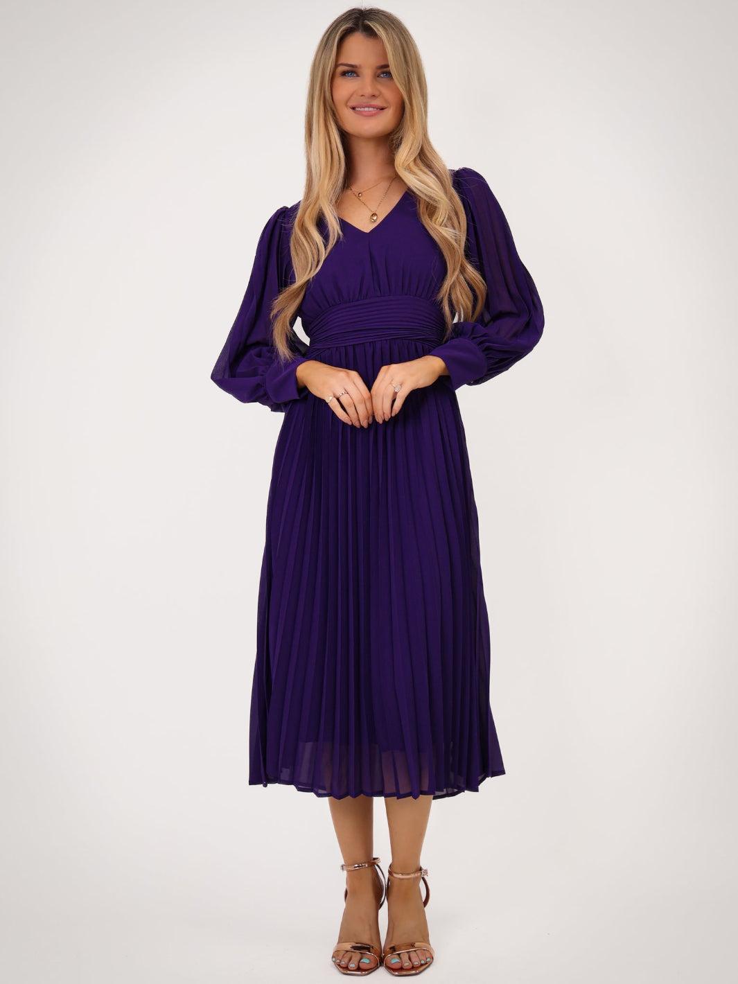 Woman wearing a purple dress on a white background