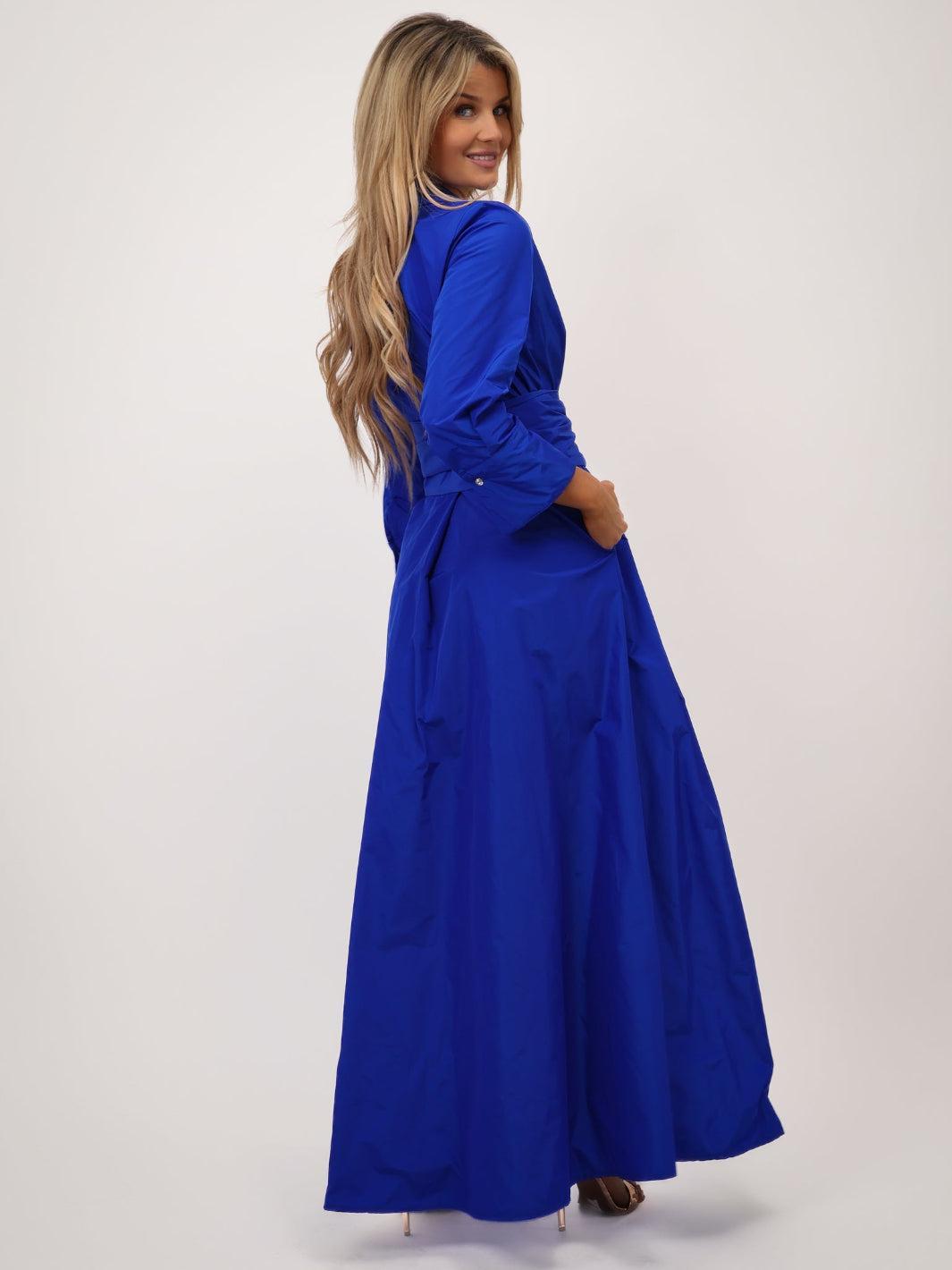 Woman wearing a blue dress on a white background