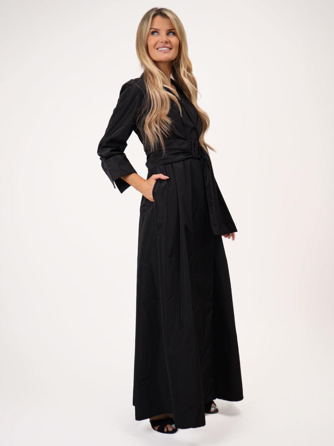 Woman wearing a black dress on a white background