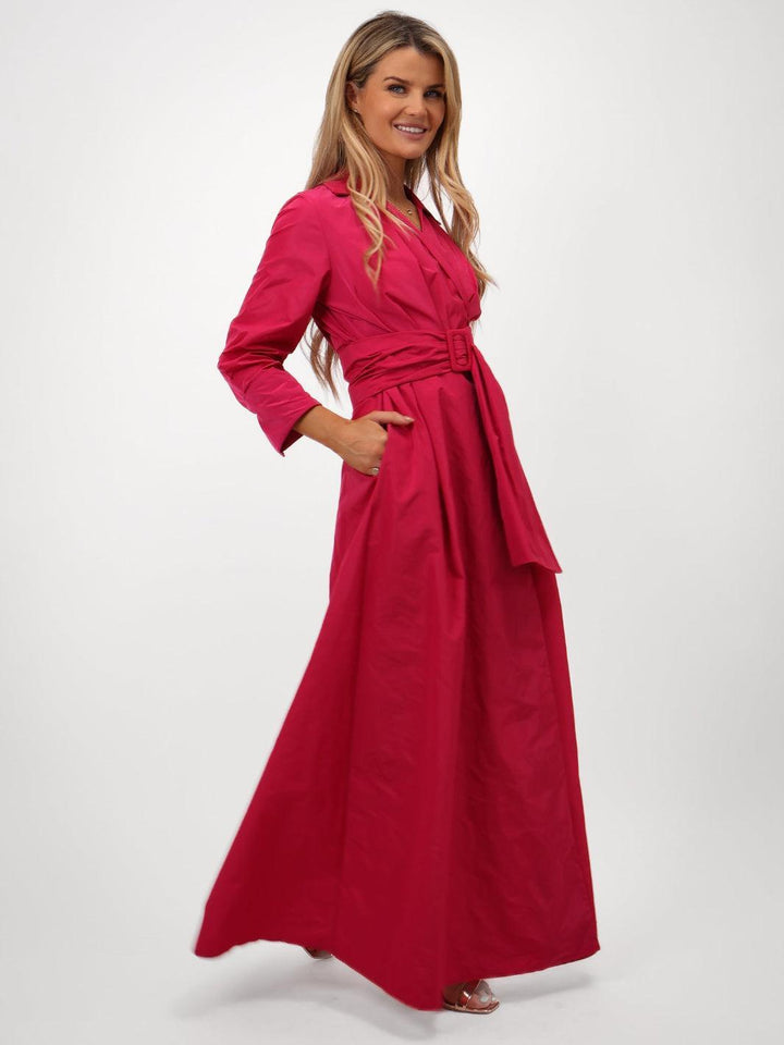 Woman wearing a pink dress on a white background