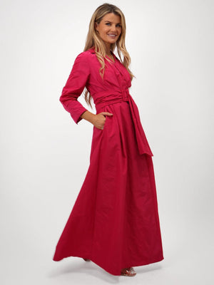 Woman wearing a pink dress on a white background