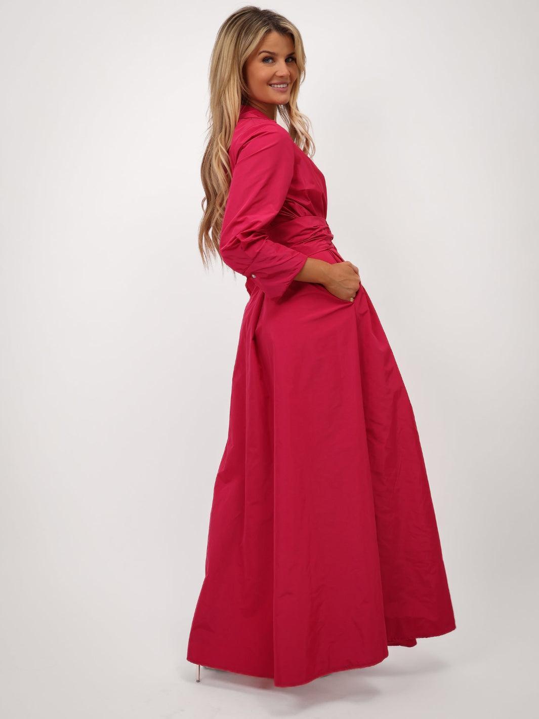 Woman wearing a red dress on a white background
