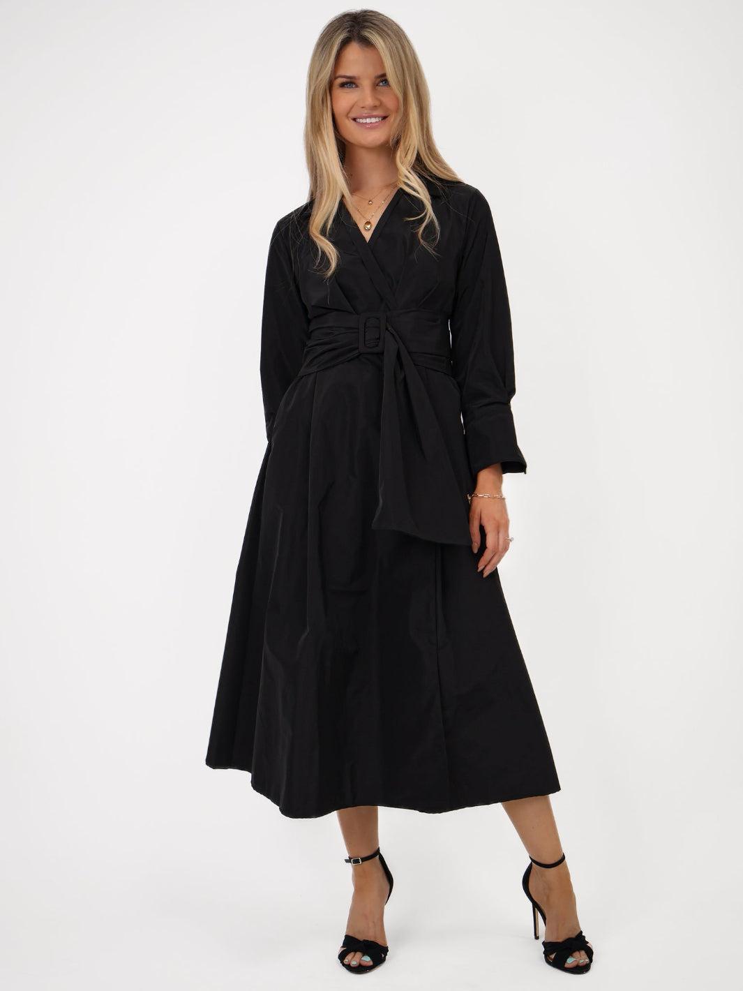 Woman wearing a black dress on a white background