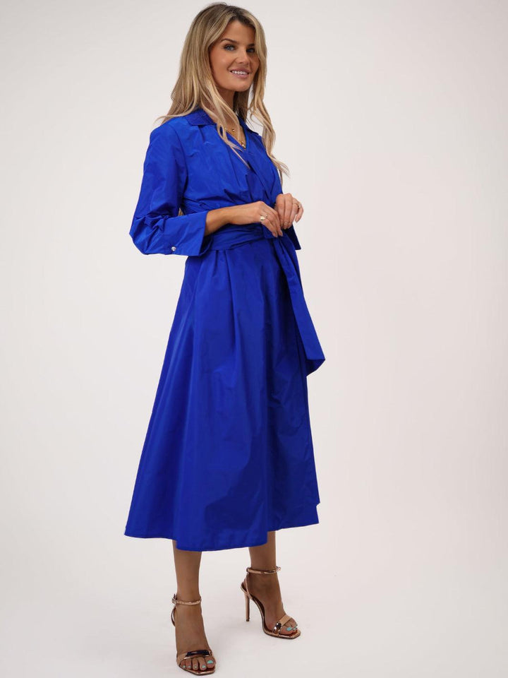 Woman wearing a blue dress on a white background