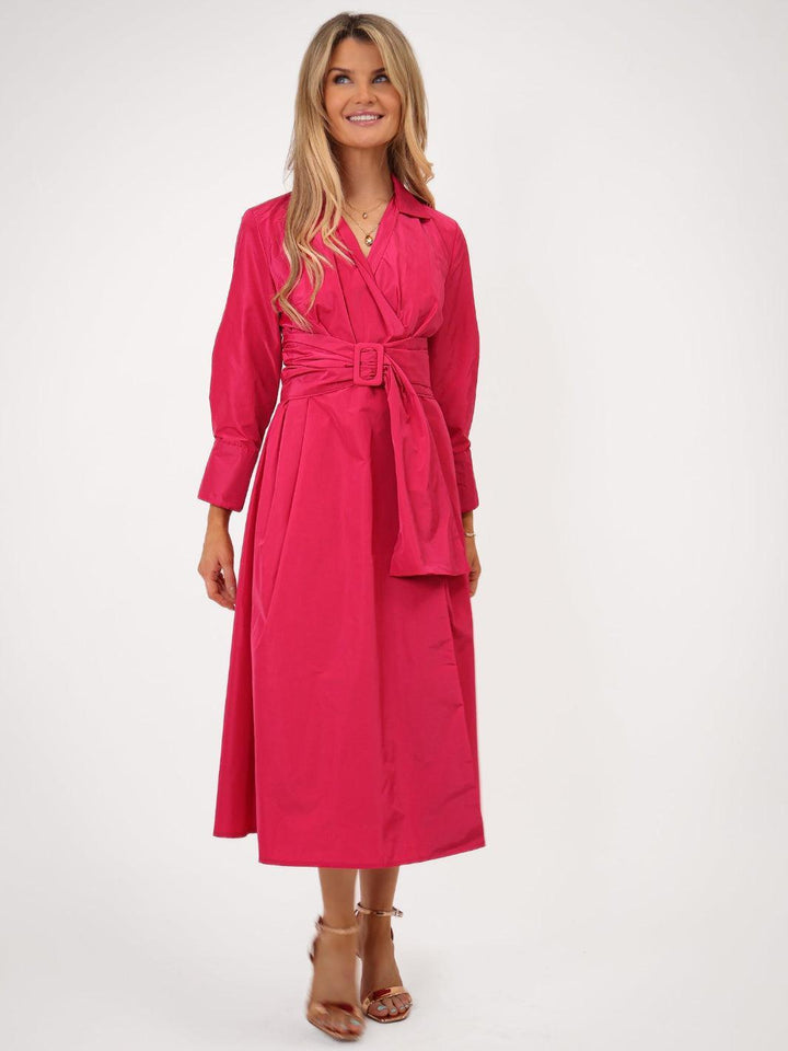 Woman wearing a pink trench coat on a white background