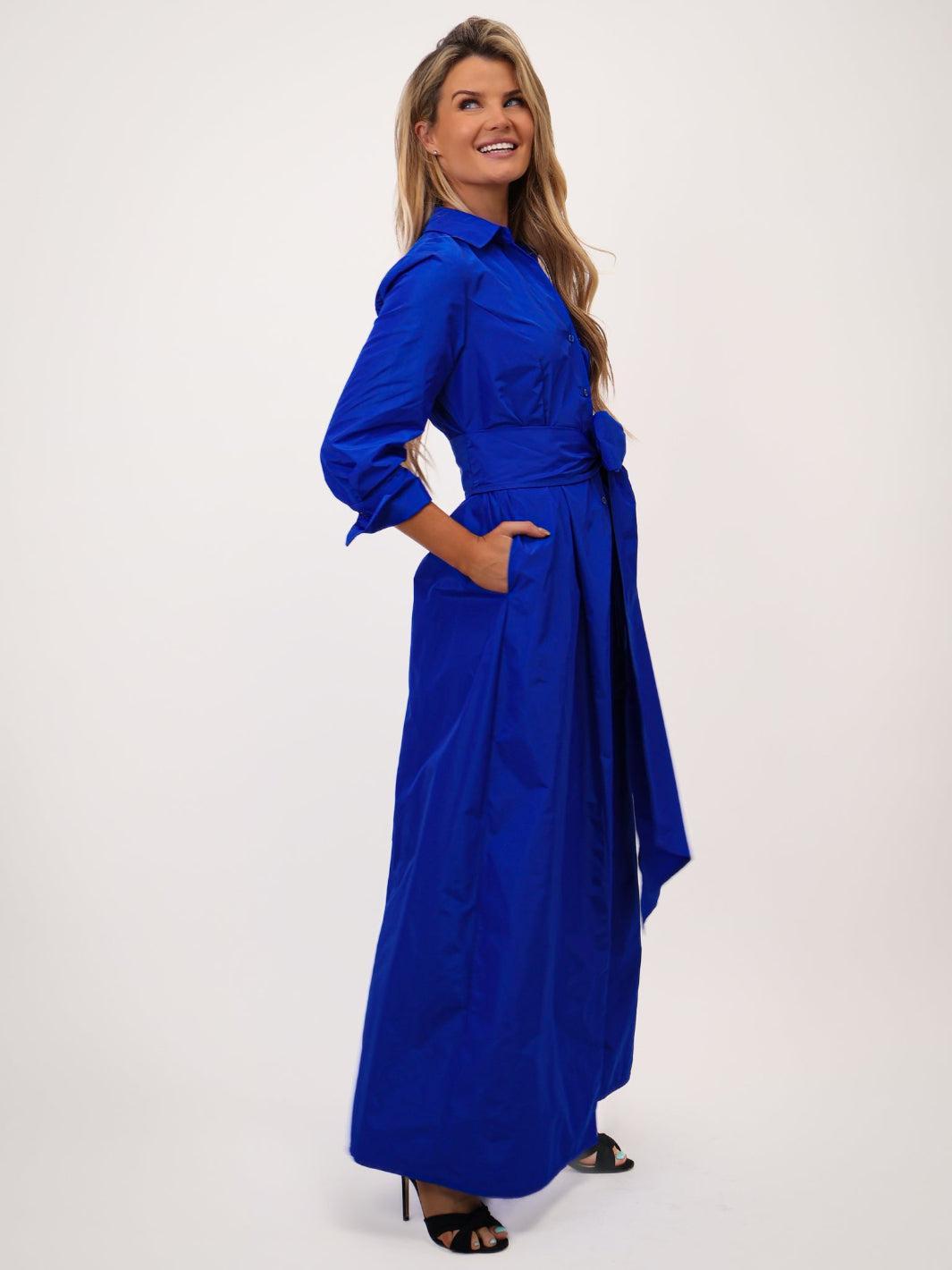 Woman wearing a blue dress on a white background