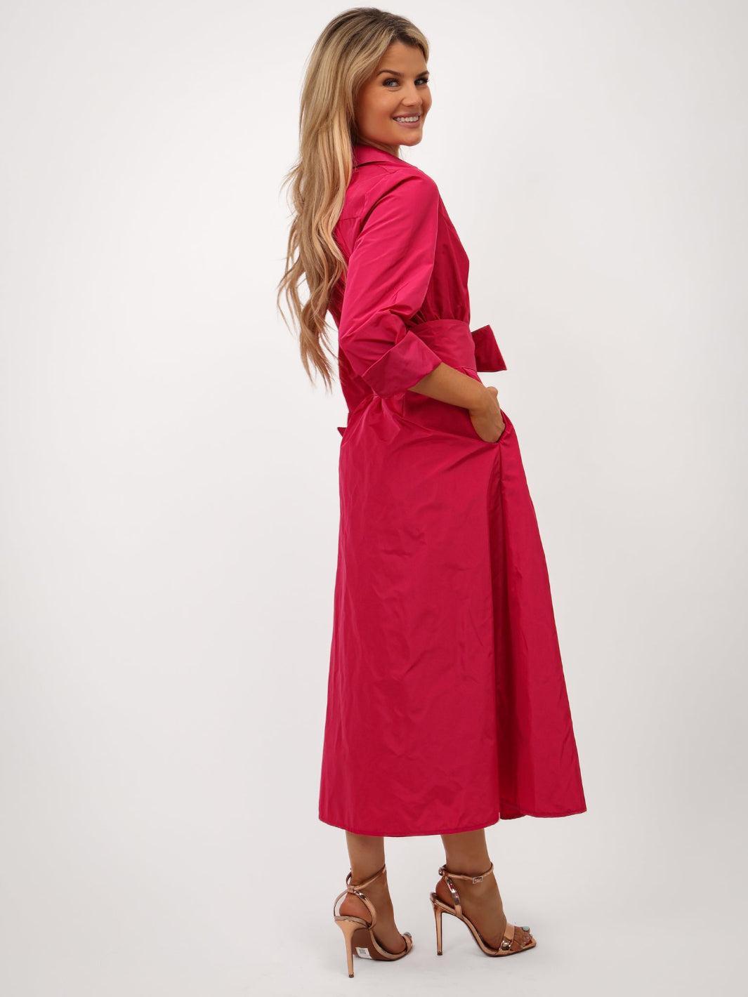 Woman wearing a pink dress on a white background