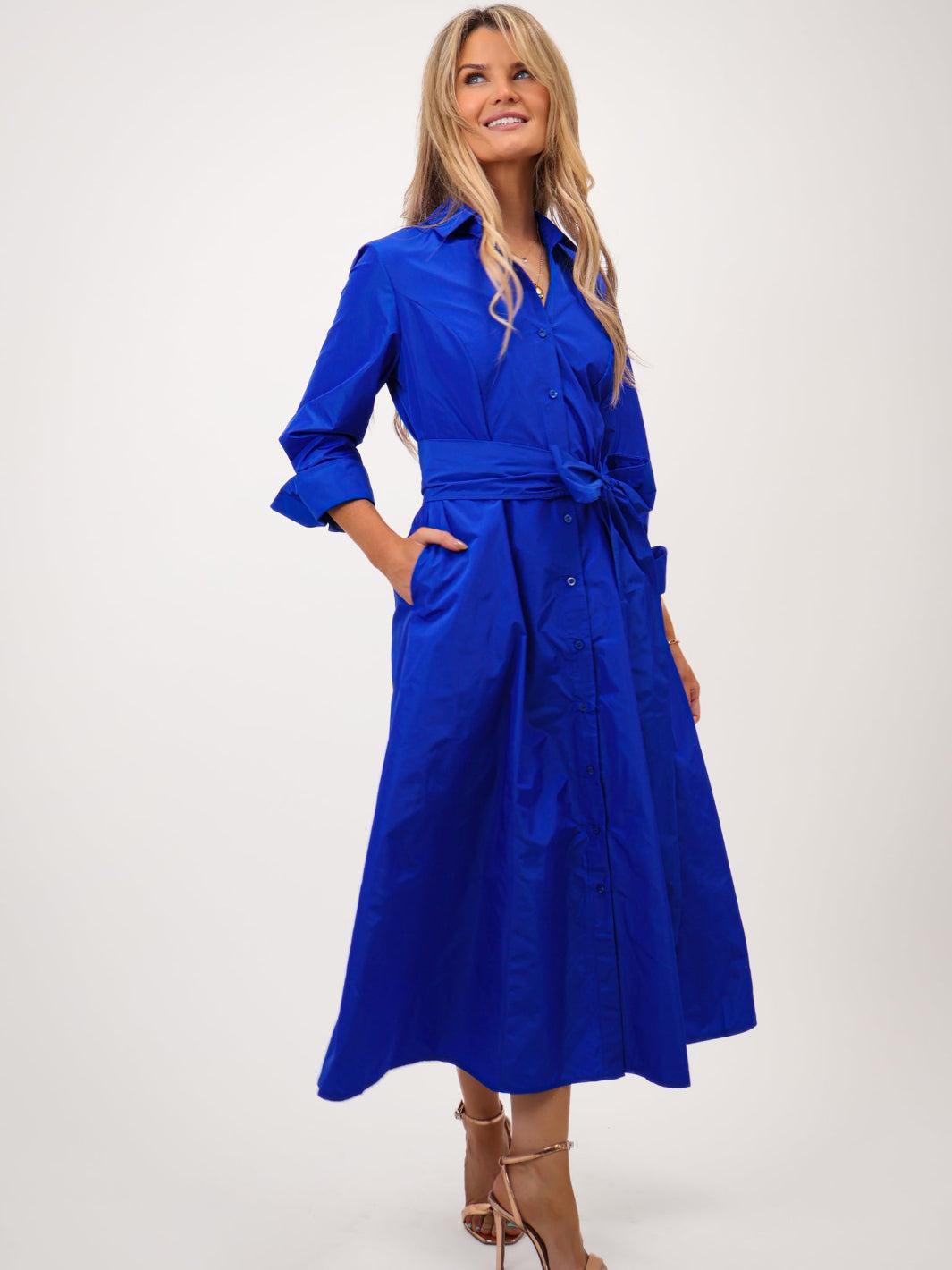 Woman wearing a blue dress on a white background