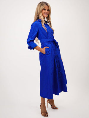 Woman wearing a blue dress on a white background