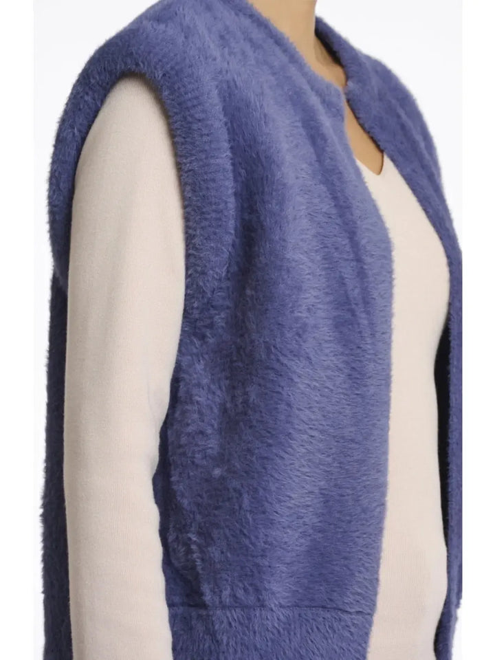 Blue knitted vest worn by a mannequin on a white background